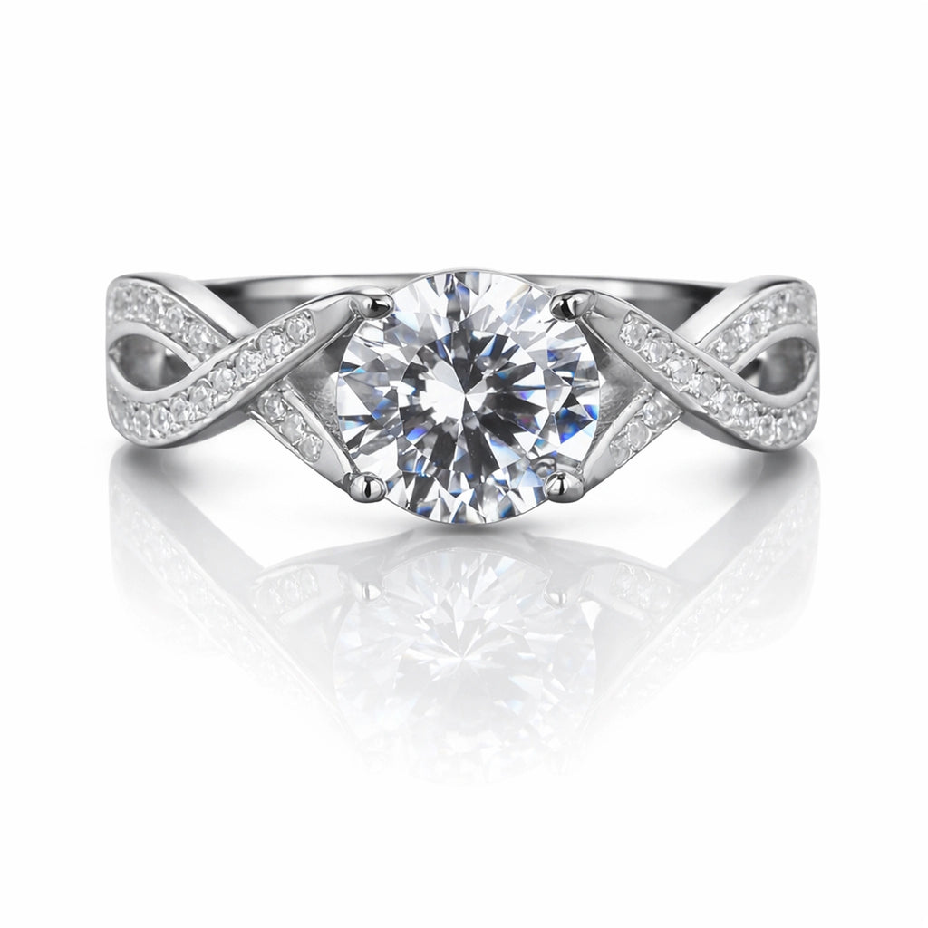 925 sterling silver infinity twist engagement ring with round brilliant simulated diamond and pavé accent band on white background